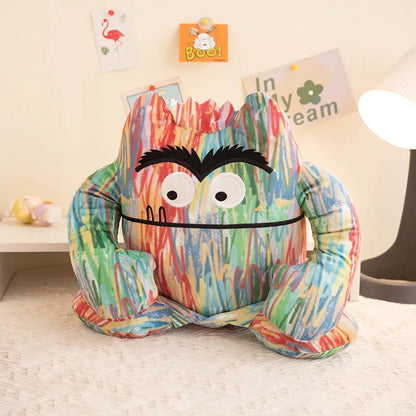 Small 15cm color feelings monster plush sitting on a desk as a daily companion