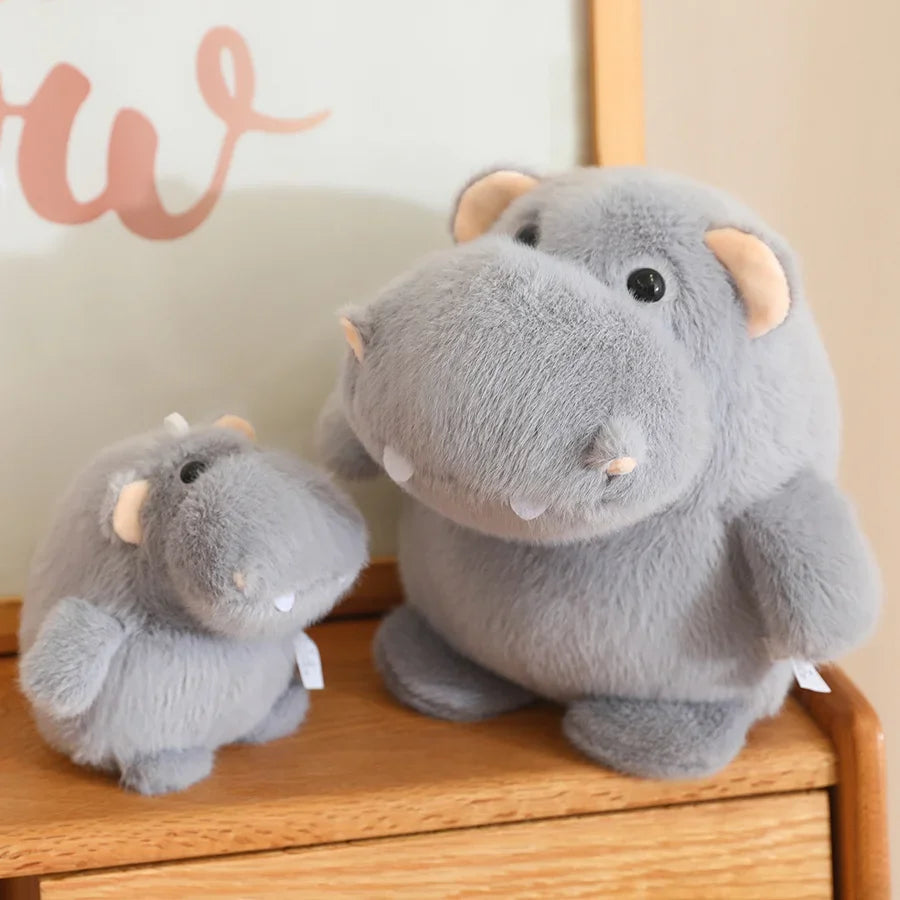 Small size hippo doll next to keyboard as a desk companion plush for adults