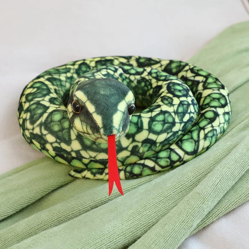 Snake prank toy lifelike python stuffed animal hidden under cushion