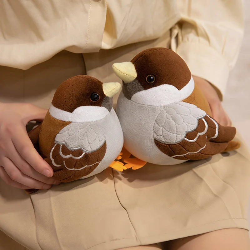 Soft bird plushie sparrow held in hand showing size comparison
