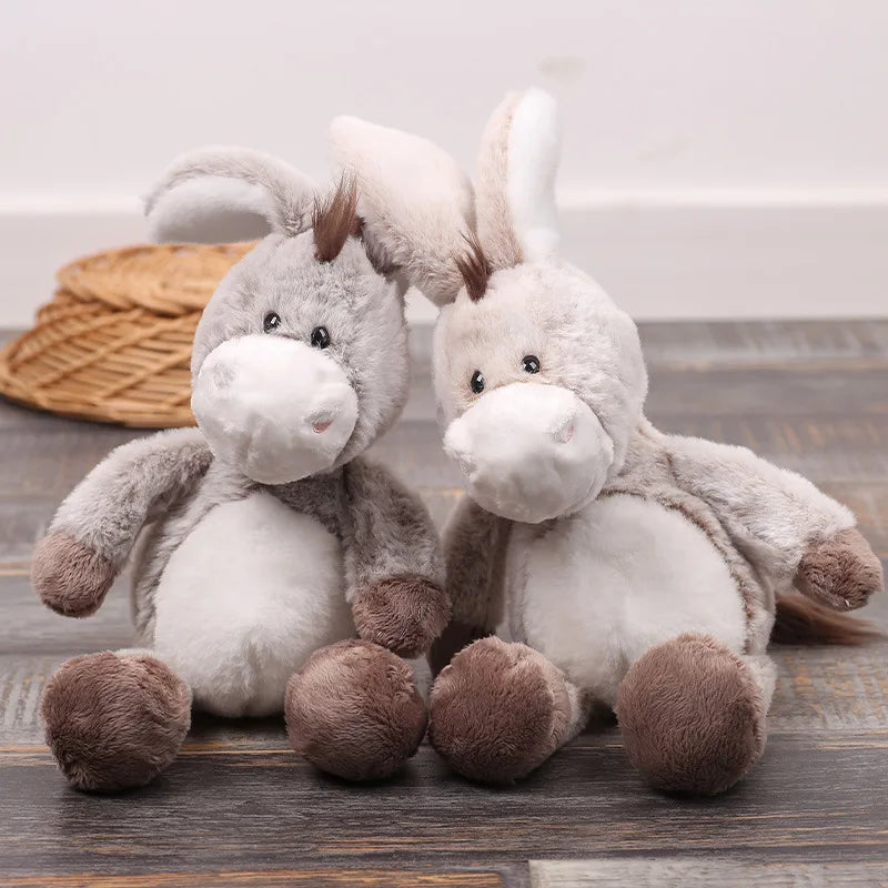 Soft donkey toy close up showing oversized floppy ear detail