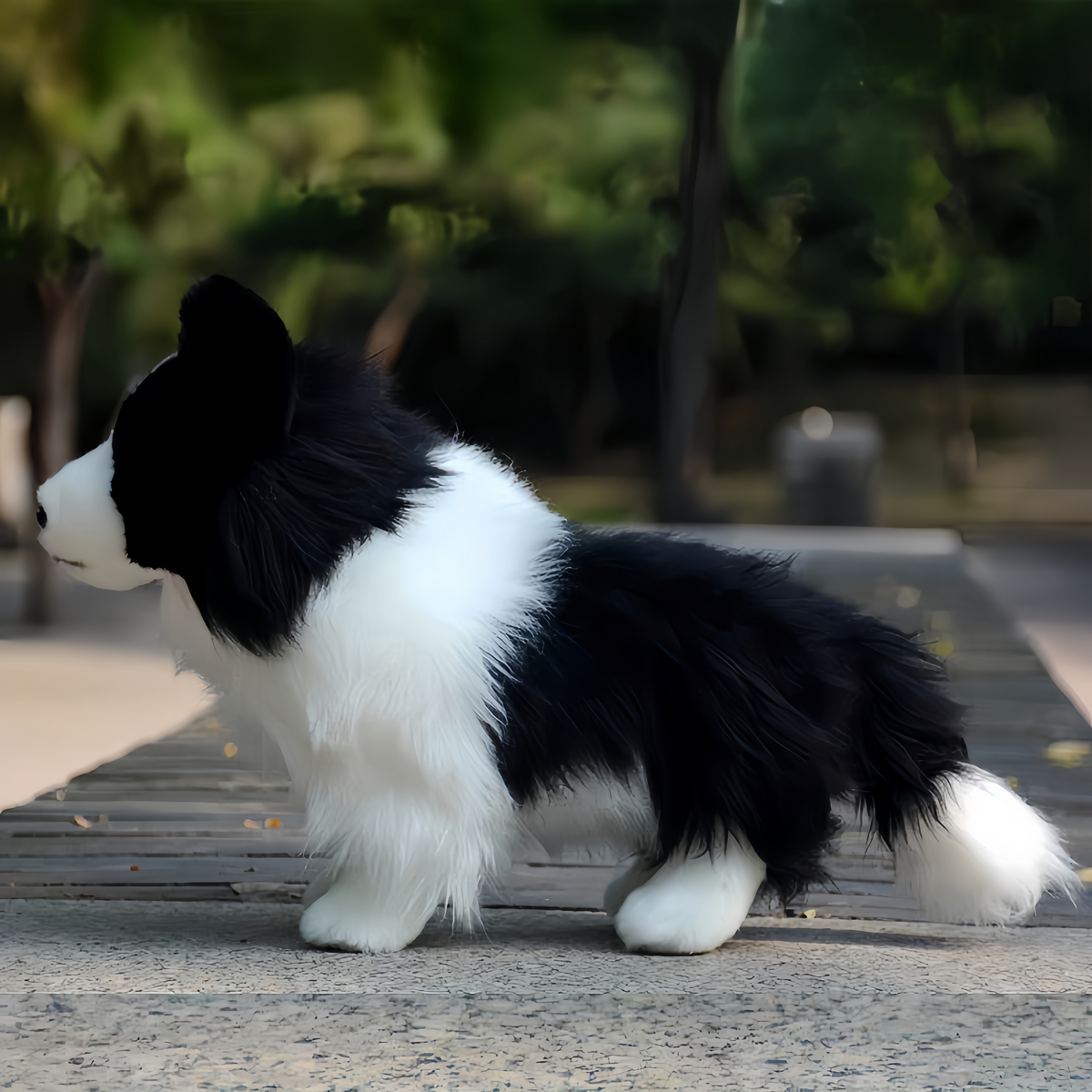 Soft fluffy stuffed puppy border collie close up face