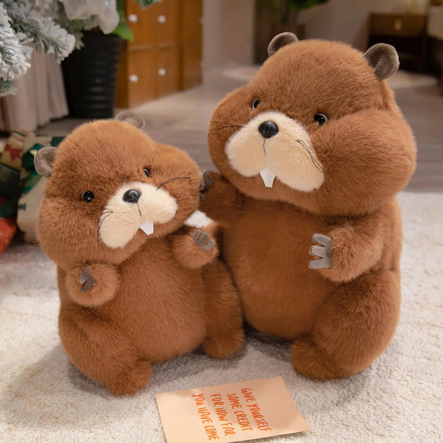 Soft groundhog toy in large size propped against a neutral background
