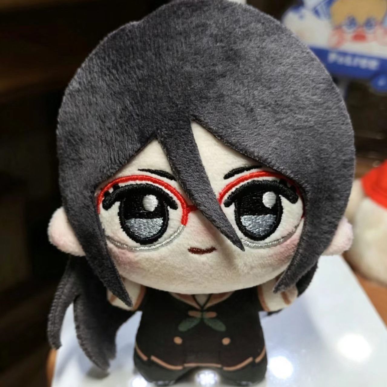 Sound Euphonium Asuka plush displayed on anime desk shelf alongside figures