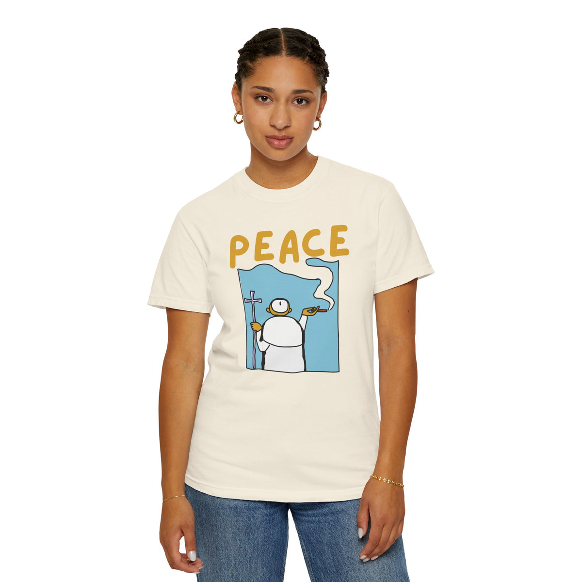 Spiritual aesthetic fashion tee hanging on wooden hanger against white wall