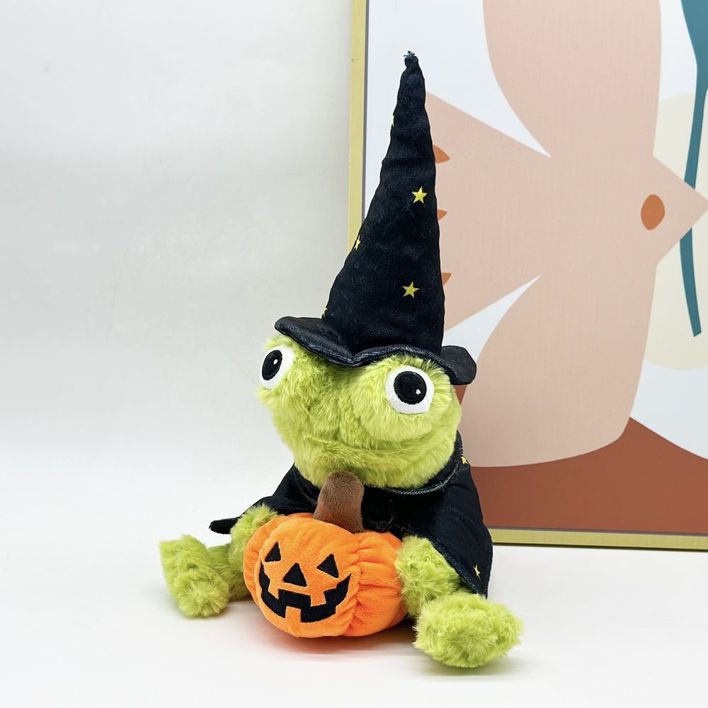 Spooky cute frog plush front view showing full wizard costume with hat cape and pumpkin prop