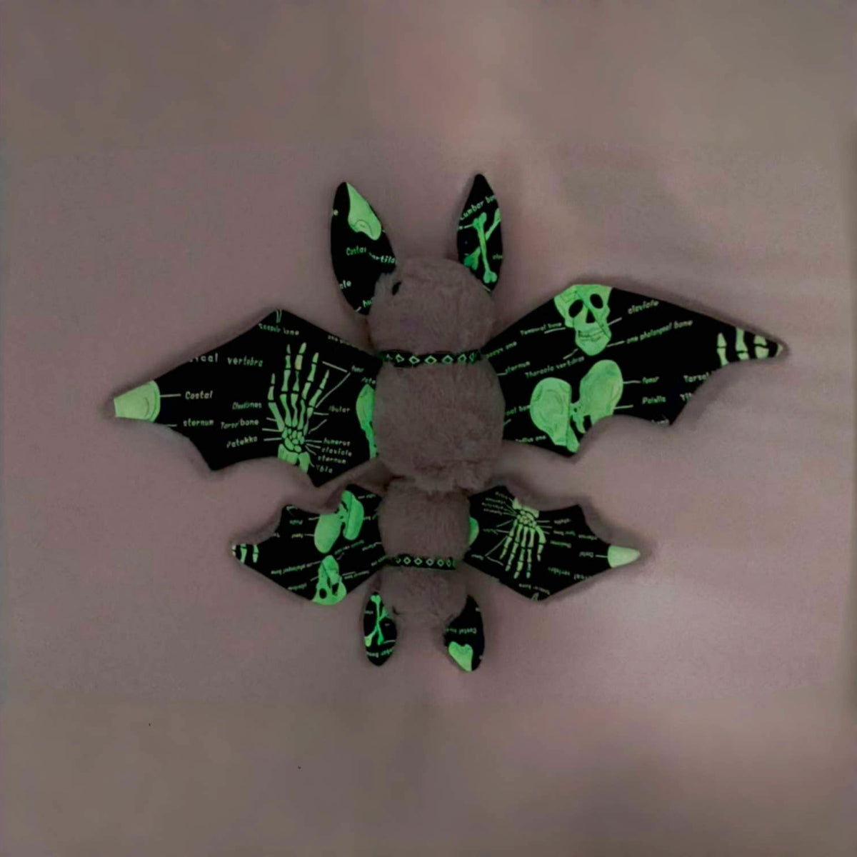 Spooky novelty gift bat plush in Halloween display setting