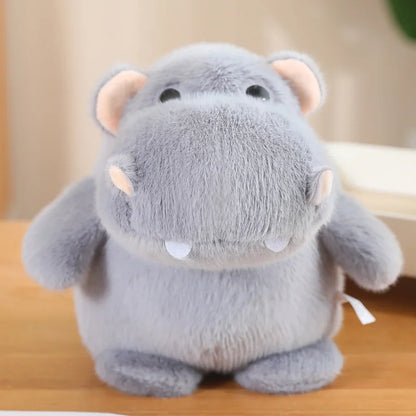 Squishy hippo plush from side angle showing exaggerated barrel-shaped body