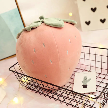 Strawberry plushie decoration on pastel pink desk aesthetic setup
