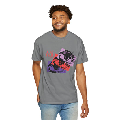 Streetwear graphic tee on urban rooftop setting at dusk with city skyline background