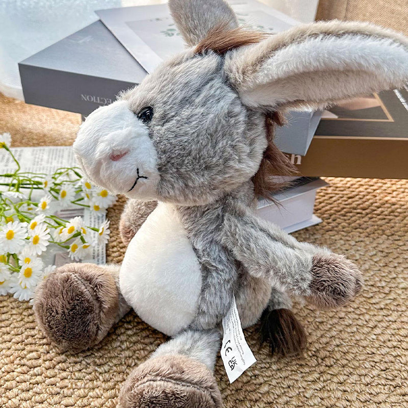 Stuffed donkey in a farmhouse style nursery setting