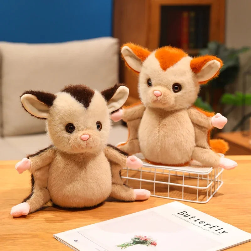 Sugar plush sitting upright, soft blue-grey plush fabric close-up
