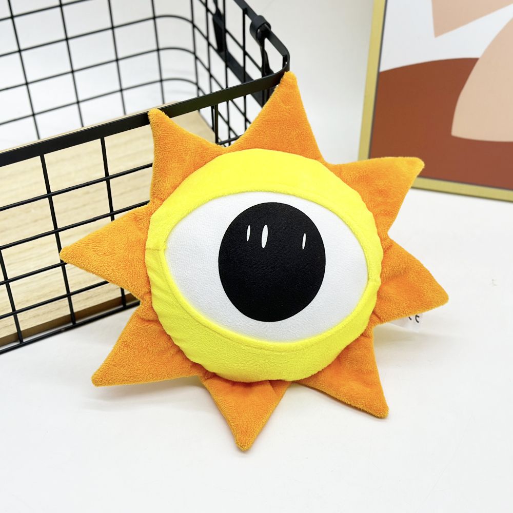 Sun plush toy cheerful face detail close-up
