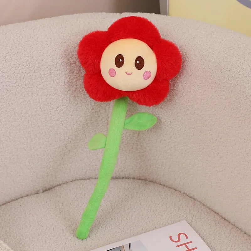 Sunflower plush and pink flower plushie side by side
