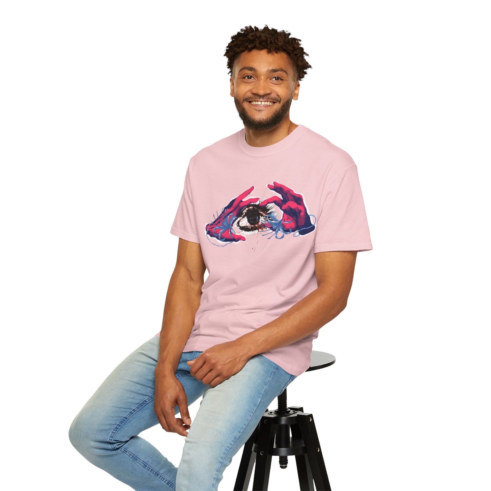 Surrealist art tee overhead flat lay with art supplies and sketchbook styling props