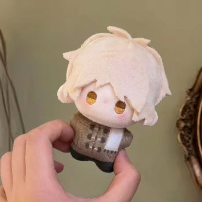 Takashi plush toy held in hand for size reference