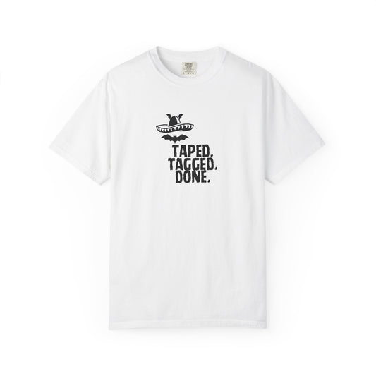 The Midnight Mariachi Taped Tagged Done graphic tee featuring bat winged sombrero design on garment dyed heavyweight cotton shirt