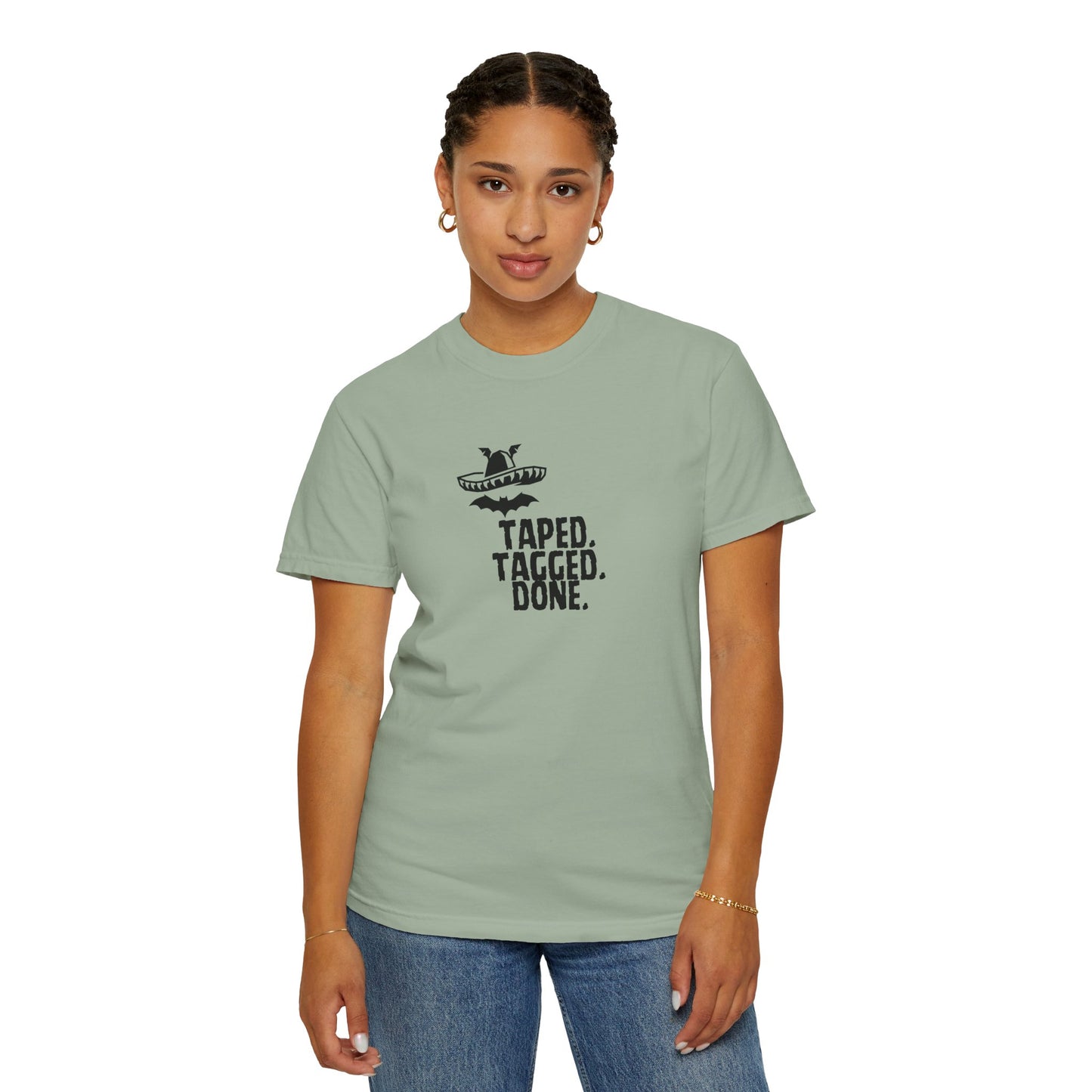 The Midnight Mariachi Taped Tagged Done graphic tee paired with joggers for weekend outfit

