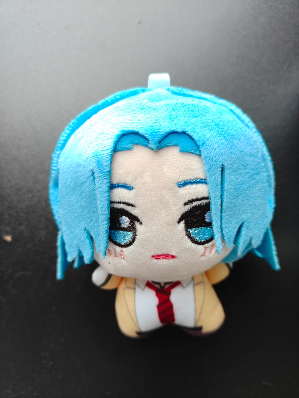 The Reki and Langa plush toys neatly arranged on a collector's shelf.