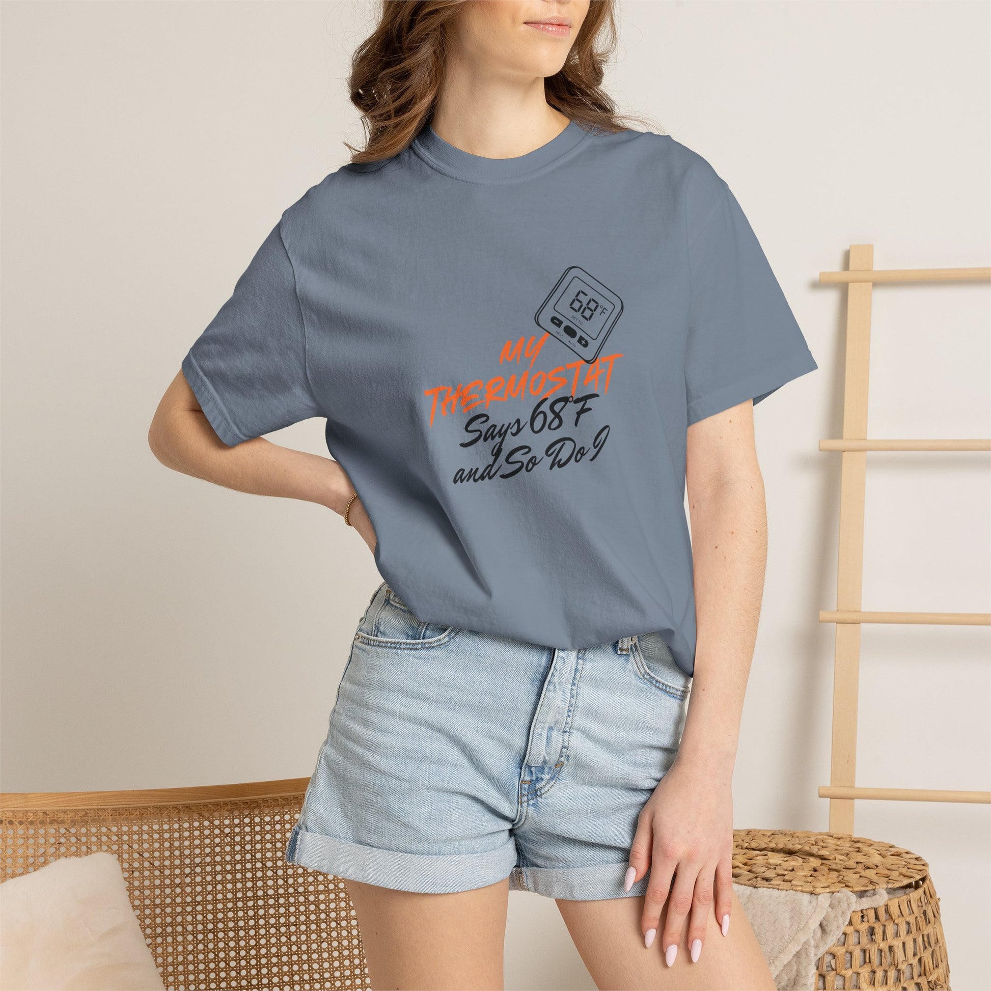 Thermostat tee model adjusting an air conditioning remote while wearing shirt
