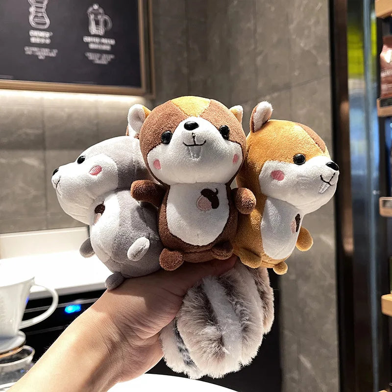 Three kawaii squirrel plush keychain variants ginger orange ash grey cocoa brown