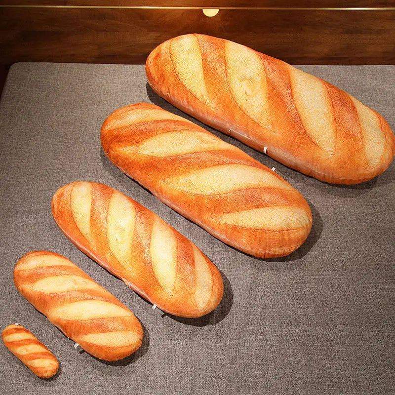 Three loaves of bread on a gray surface
