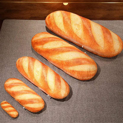 Three loaves of bread on a gray surface