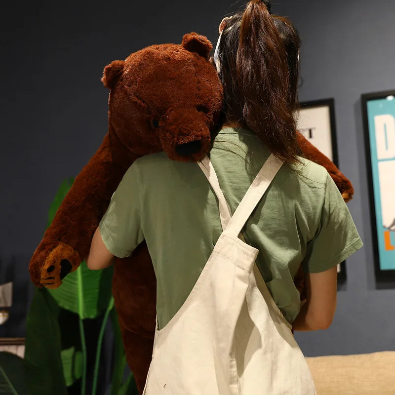Three sizes of giant simulation bear plush side by side — 40cm, 60cm, and 80cm on a wooden shelf