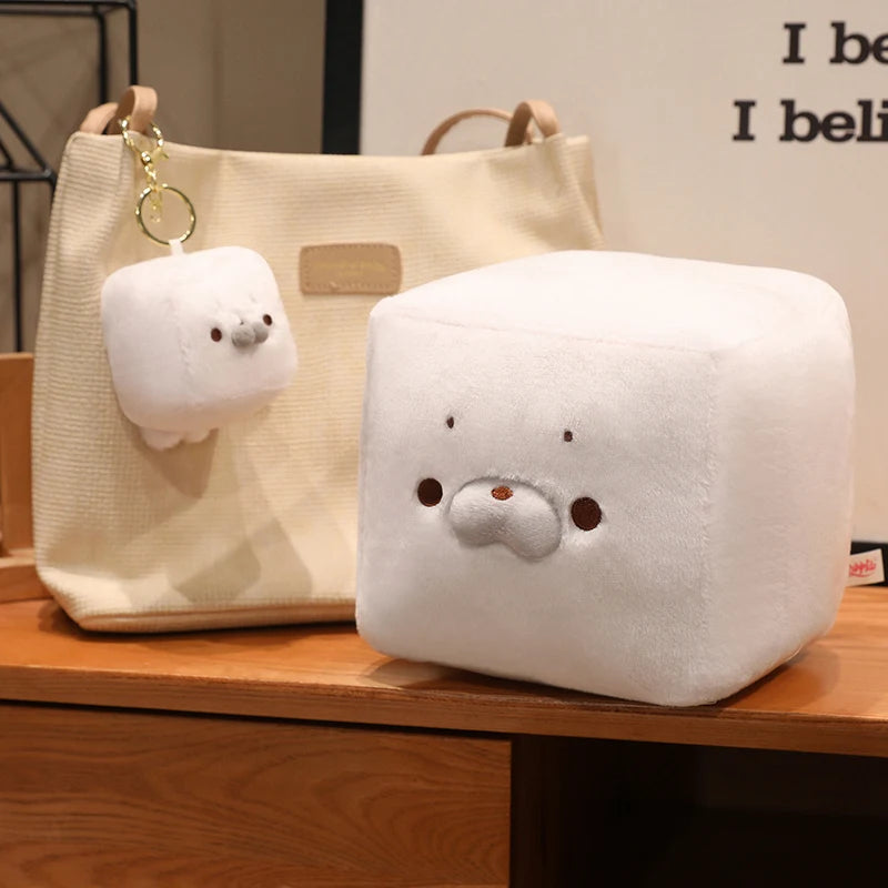 Tofu seal mochi toy being gently squeezed stress relief squishy toy demonstration
