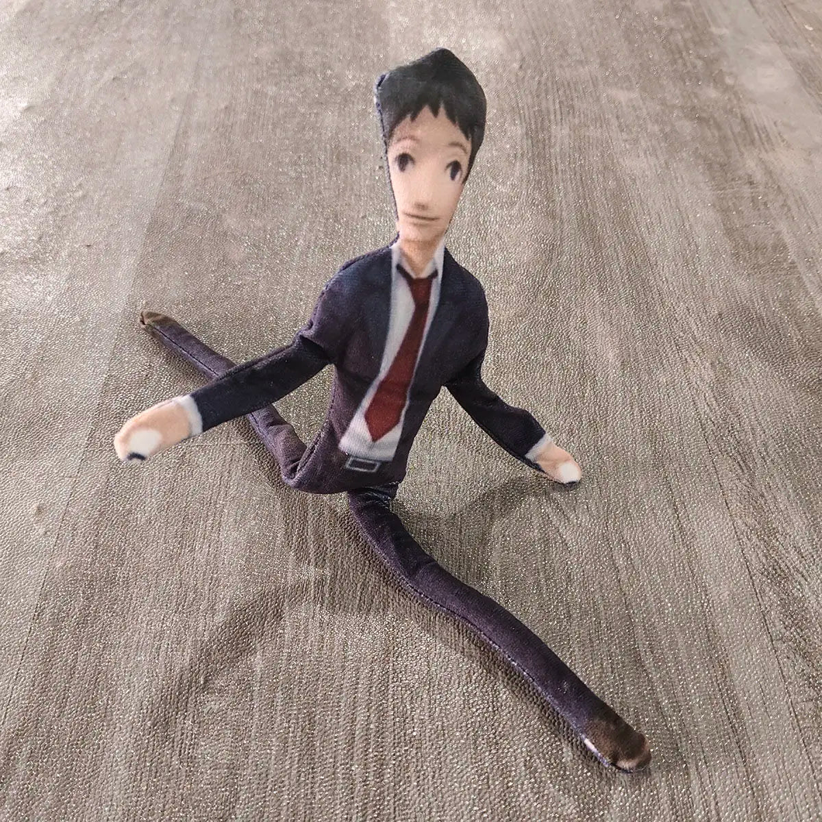 Tohru toy standing display shot on wooden shelf
