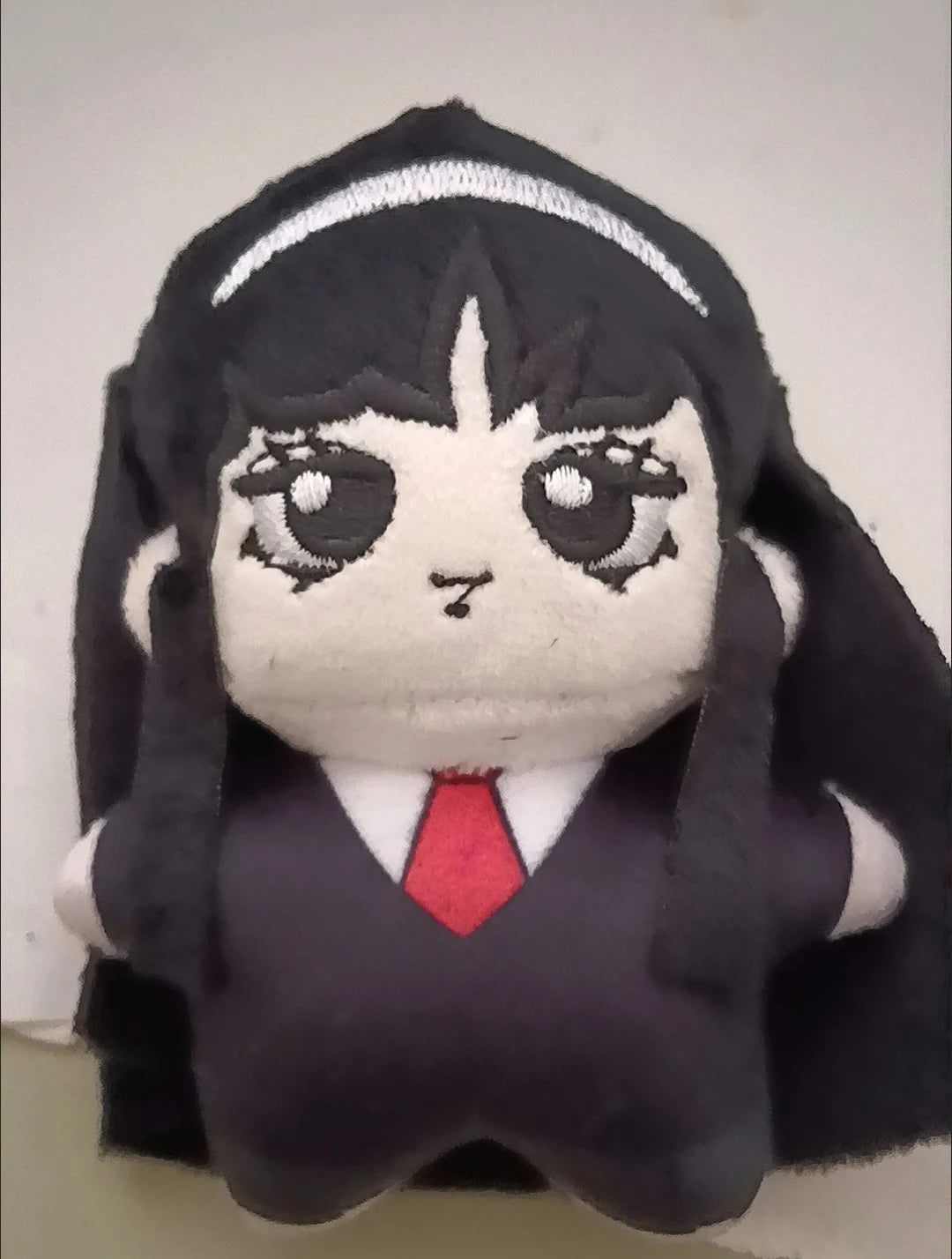 Tomie plushie worn as bag charm accent — compact Japanese horror plush collectible for everyday carry