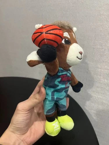 Top-down flat lay of Will Harris stuffed animal showing full body and Thorns jersey orange accents
