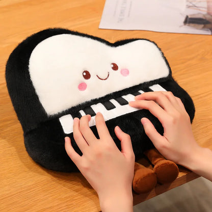 Top view of the kawaii grand piano throw cushion showing the full instrument shape in plush form