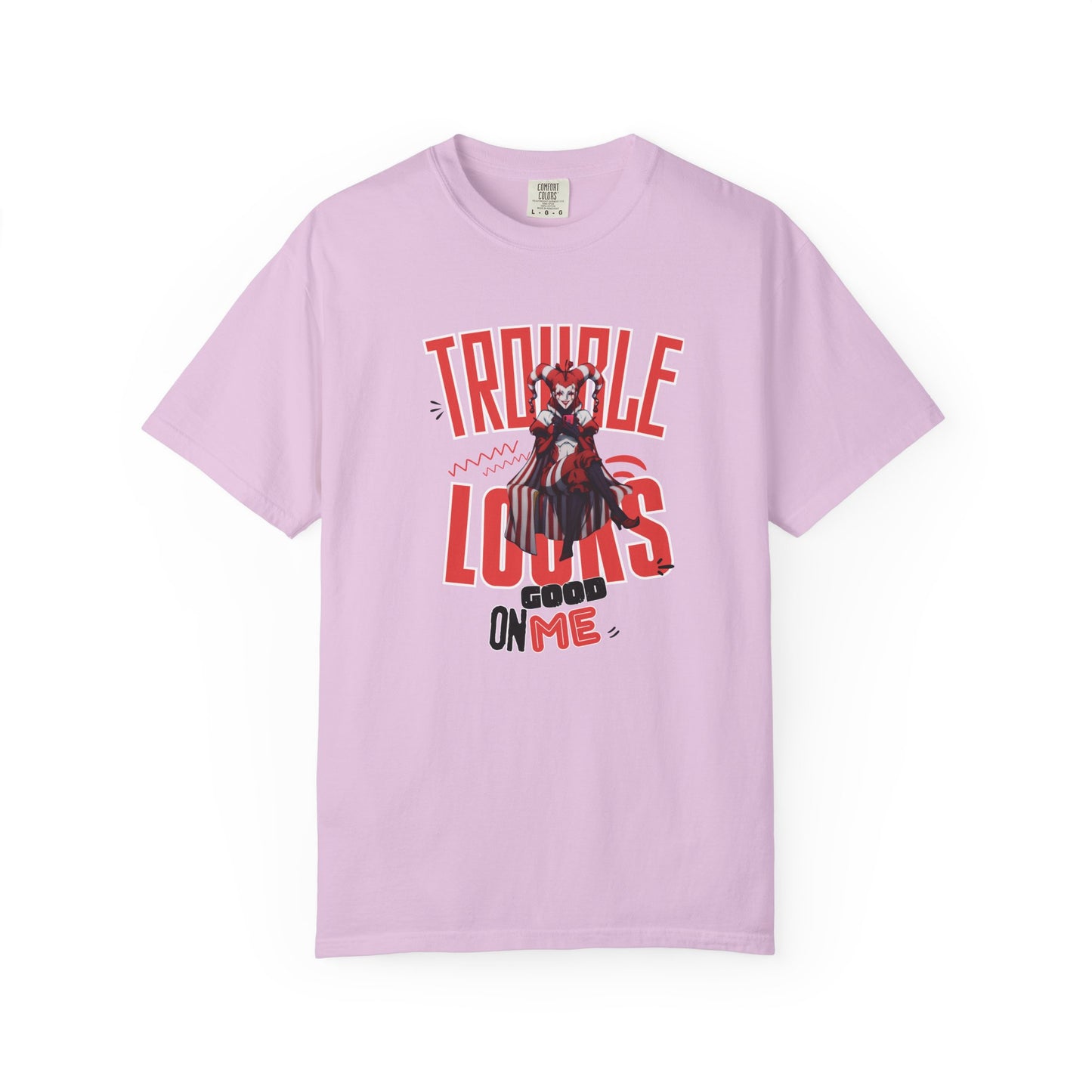 Trouble Looks Good On Me tee overhead flat lay on concrete surface, full graphic visible
