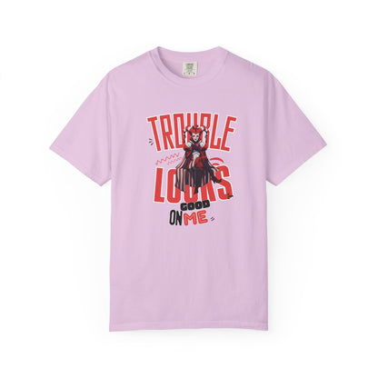 Trouble Looks Good On Me tee overhead flat lay on concrete surface, full graphic visible

