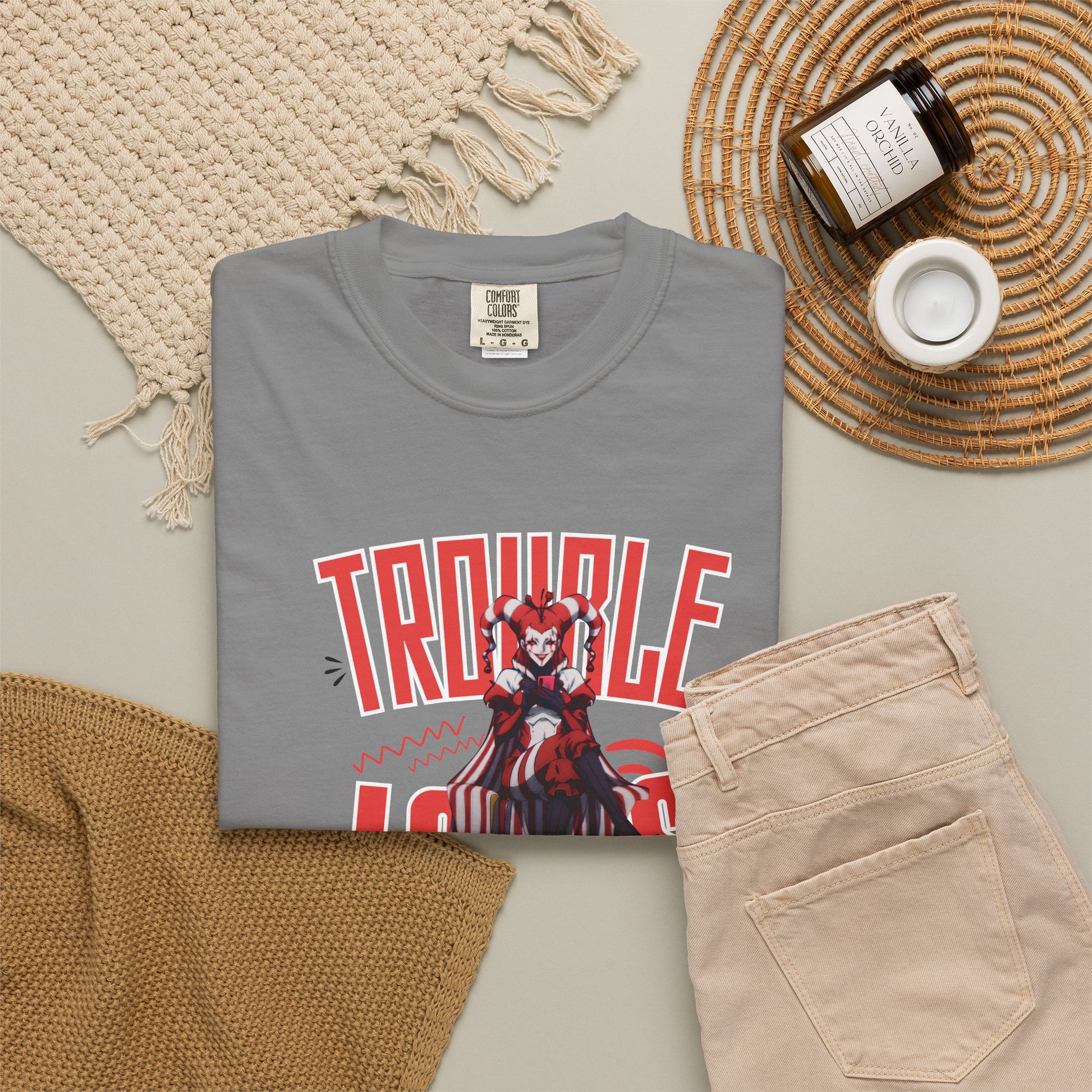 Trouble Looks Good On Me tee worn at a concert venue, crowd background, casual night look
