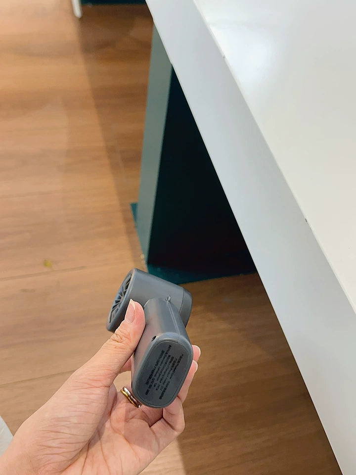 USB-C charging port on portable handheld cooling fan
