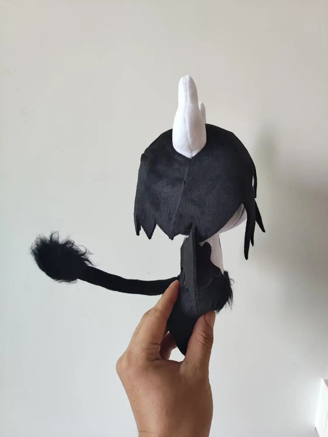 Ulquiorra Cifer plush displayed on anime shelf