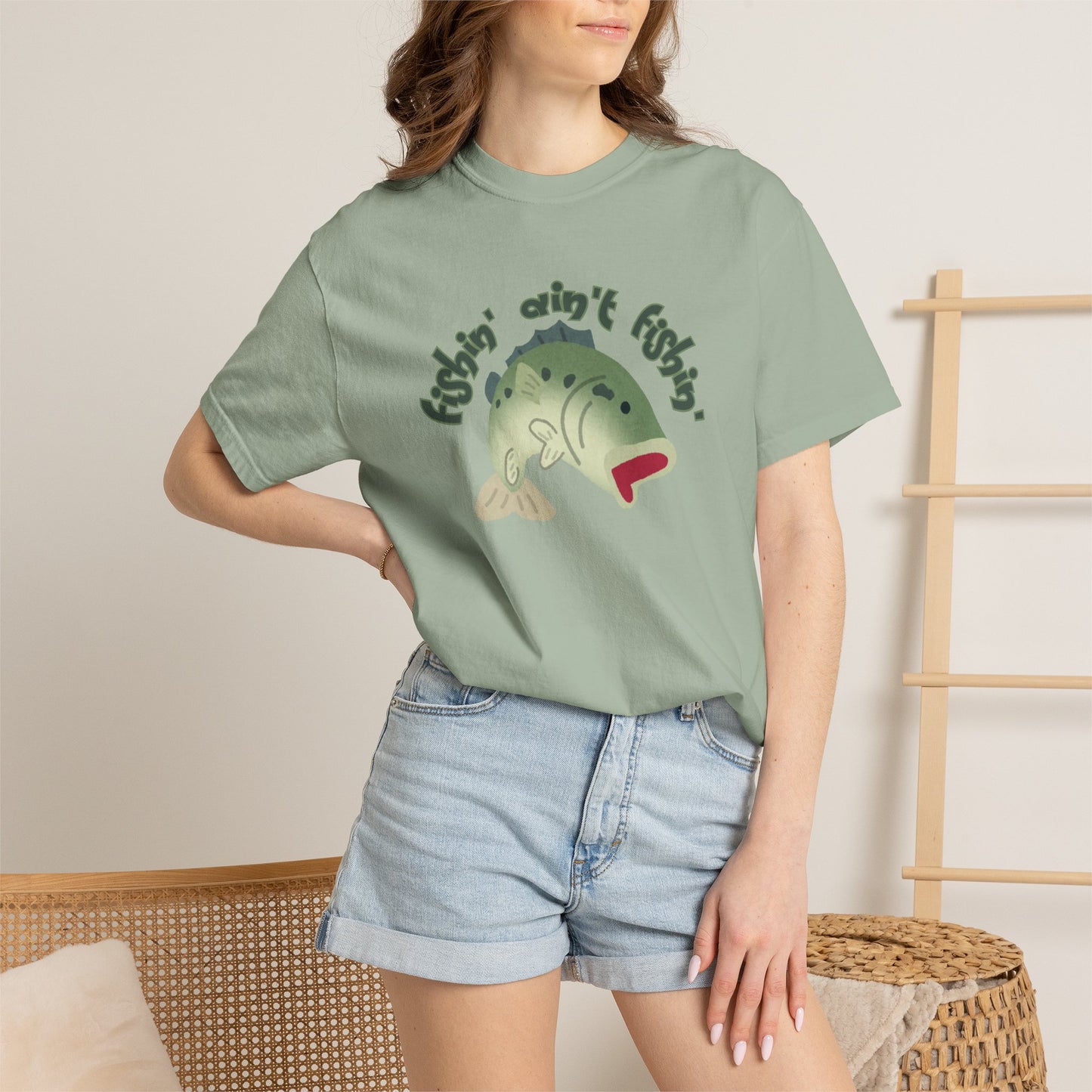 Unisex fishing humor shirt with bold bass illustration and phrase