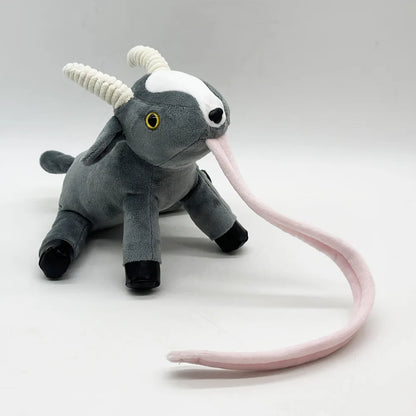 Video game plush toy Goat Simulator Pilgor sitting on gaming desk