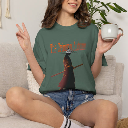 Fall graphic tee in crimson laid on autumn maple leaves
