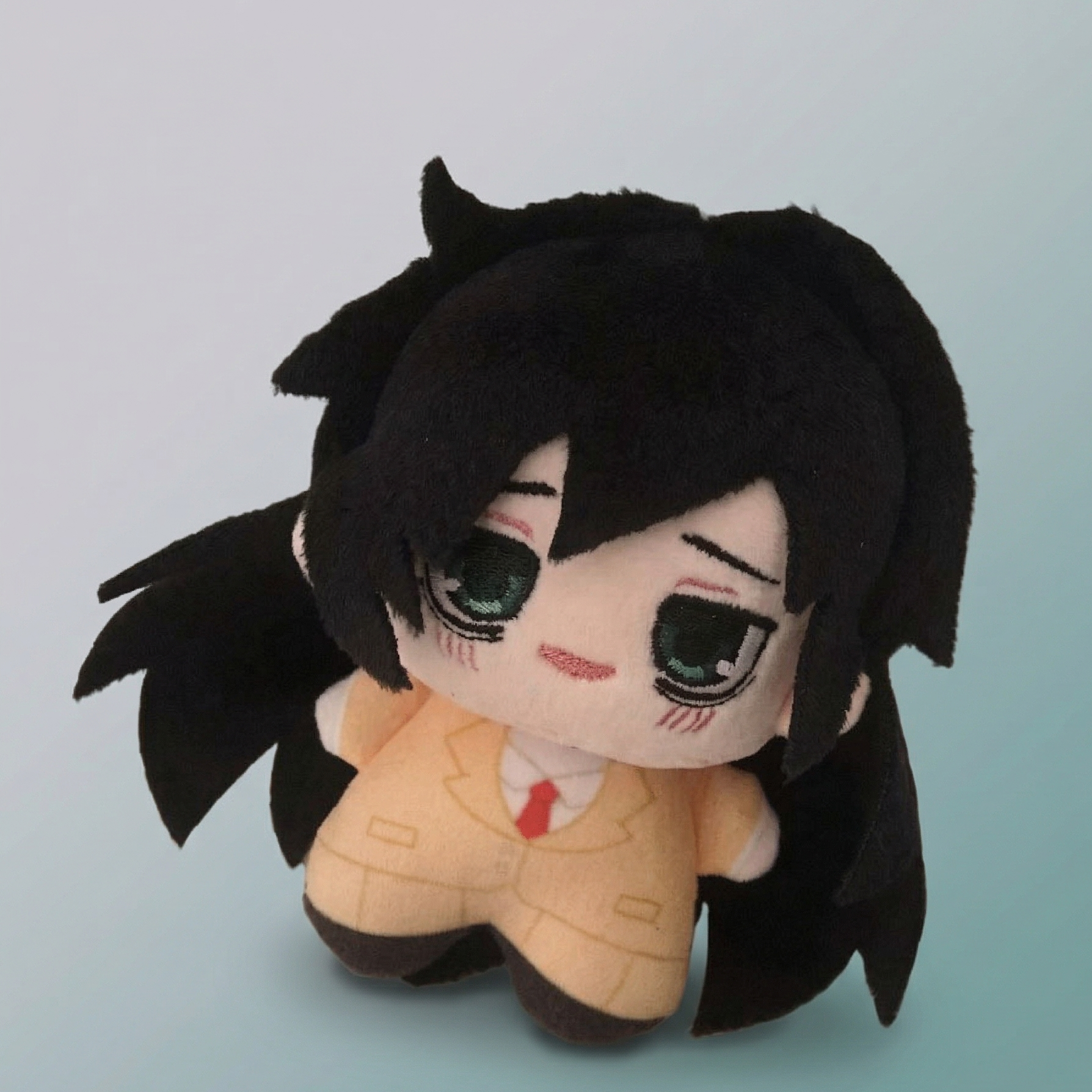 WataMote Tomoko plush pendant hanging from bag zipper
