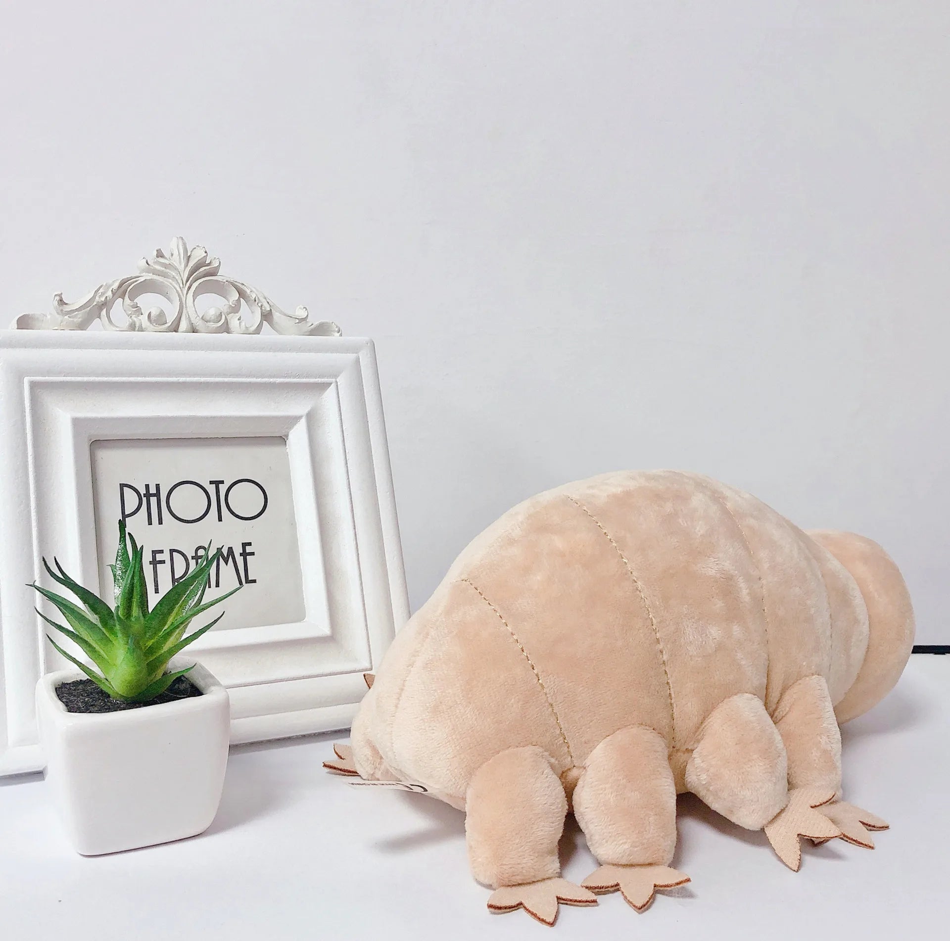 Water bear plush close-up leg detail

