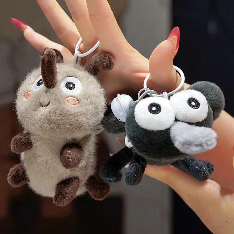 Weird plushie mosquito keychain attached to backpack strap