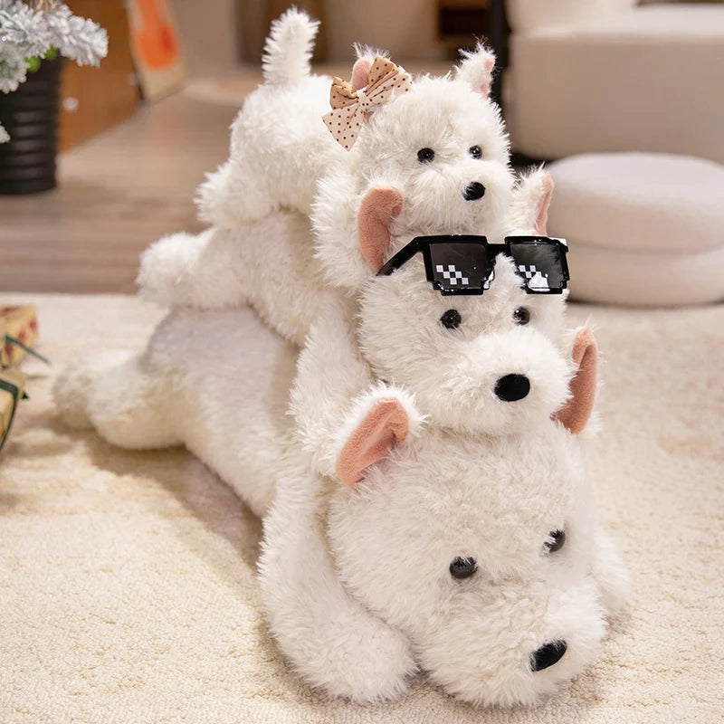 Westie stuffed animal with white fluffy coat displayed on a bed
