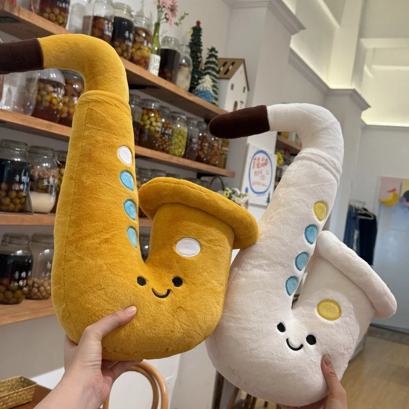 White 20cm saxophone plush charm with attachment loop close up