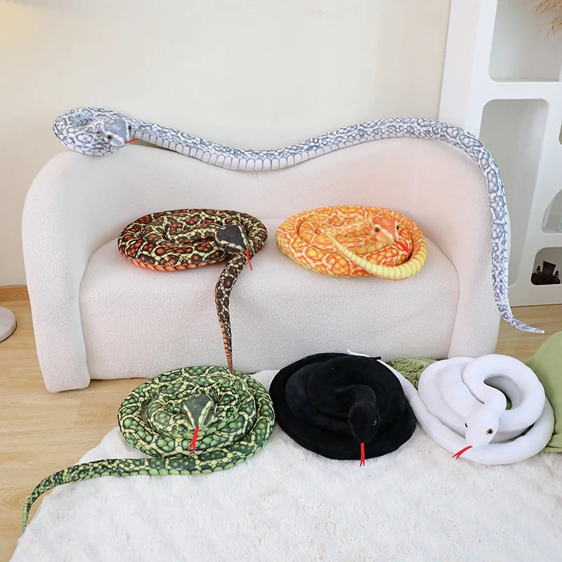 White snake plushie large realistic python stuffed animal on bed