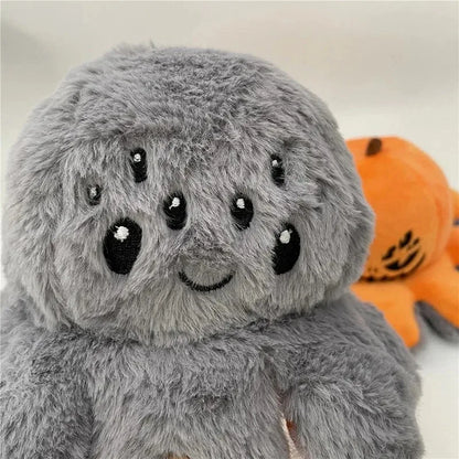 Wide eyed gray spider plush toy displayed upright after flipping from the pumpkin side, kawaii Halloween plushie