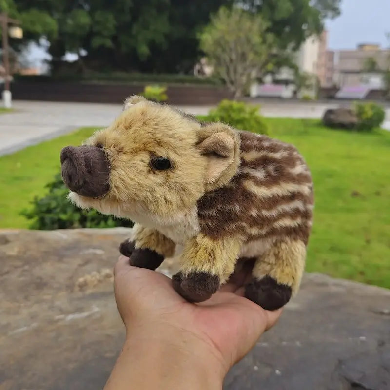 Wild boar piglet plush toy close up showing detailed facial features and snout