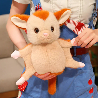 Wildlife plush sugar glider standing on a branch prop, nature-inspired photography
